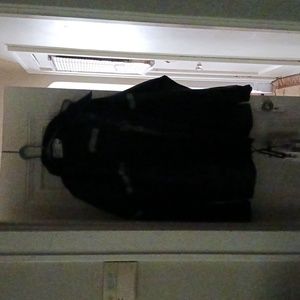 1. A complete Storm rider rain suit. Size 2X. I pants, 1 jacket, 1 pr over boots